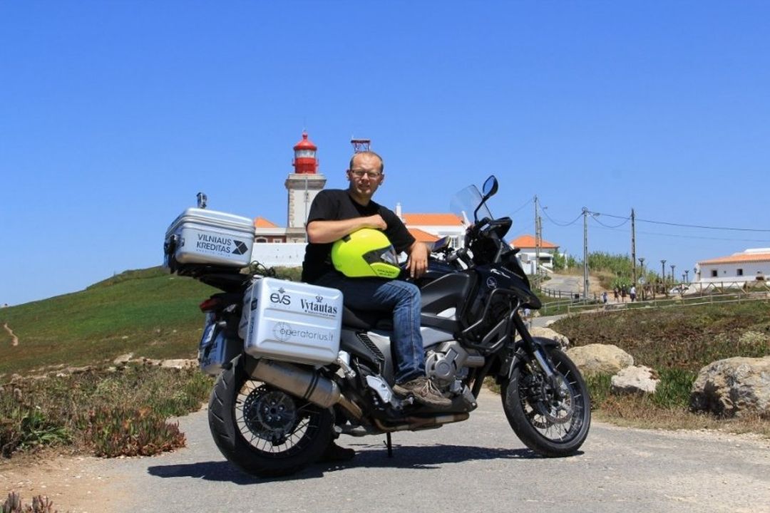 Motorcycle traveller Aidas Bubinas near his motorcycle